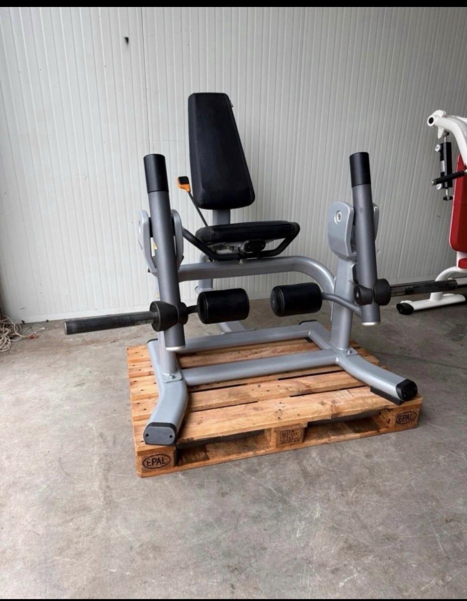 Precor plate loaded leg extension / gym